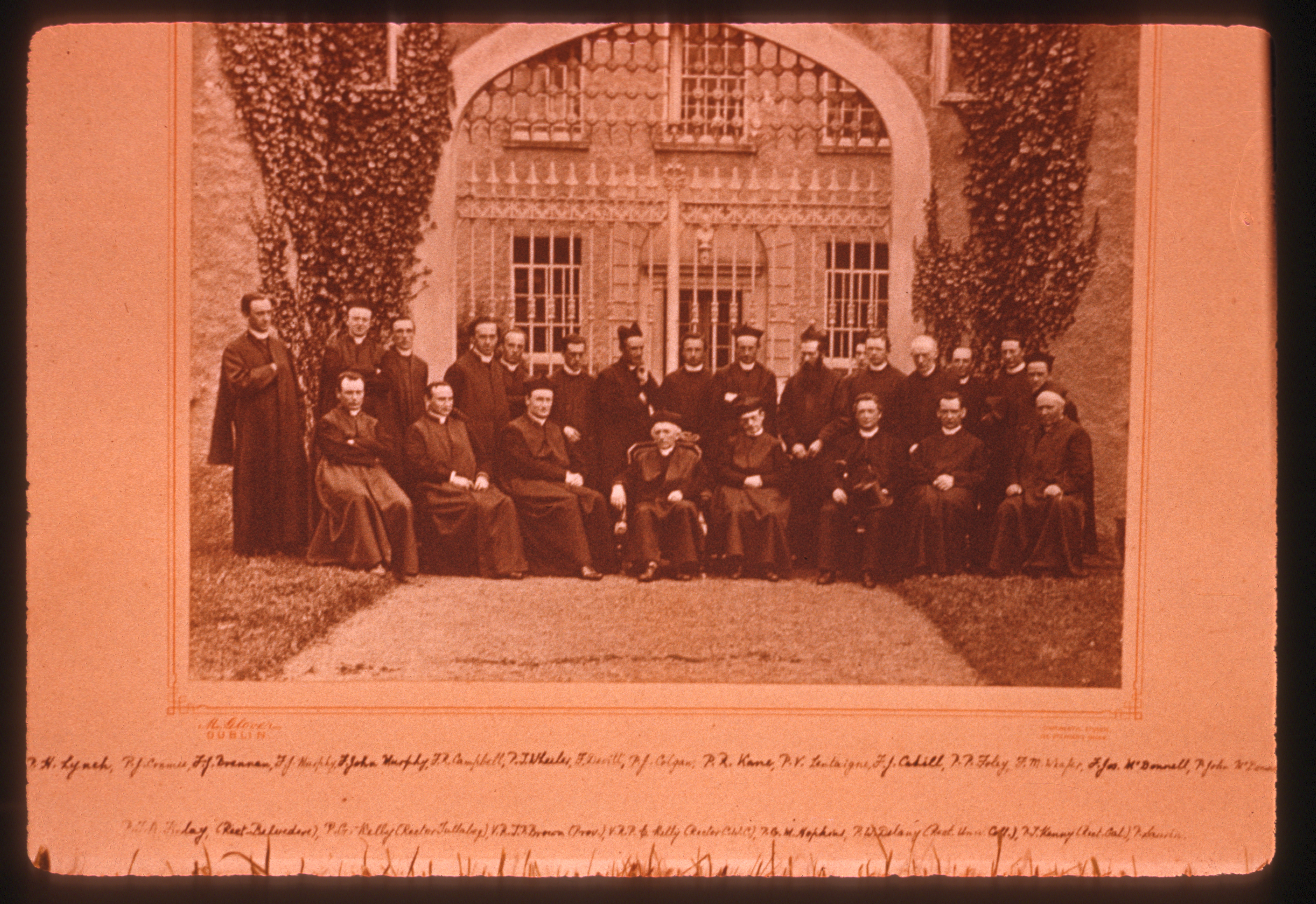 a photograph of Hopkins and twenty two other Jesuits formally posing